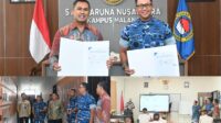 Danlanud Abd Saleh dan Kepala SMA Taruna Nusantara Kampus Malang memperlihatkan lembar kesepakatan kerja sama.